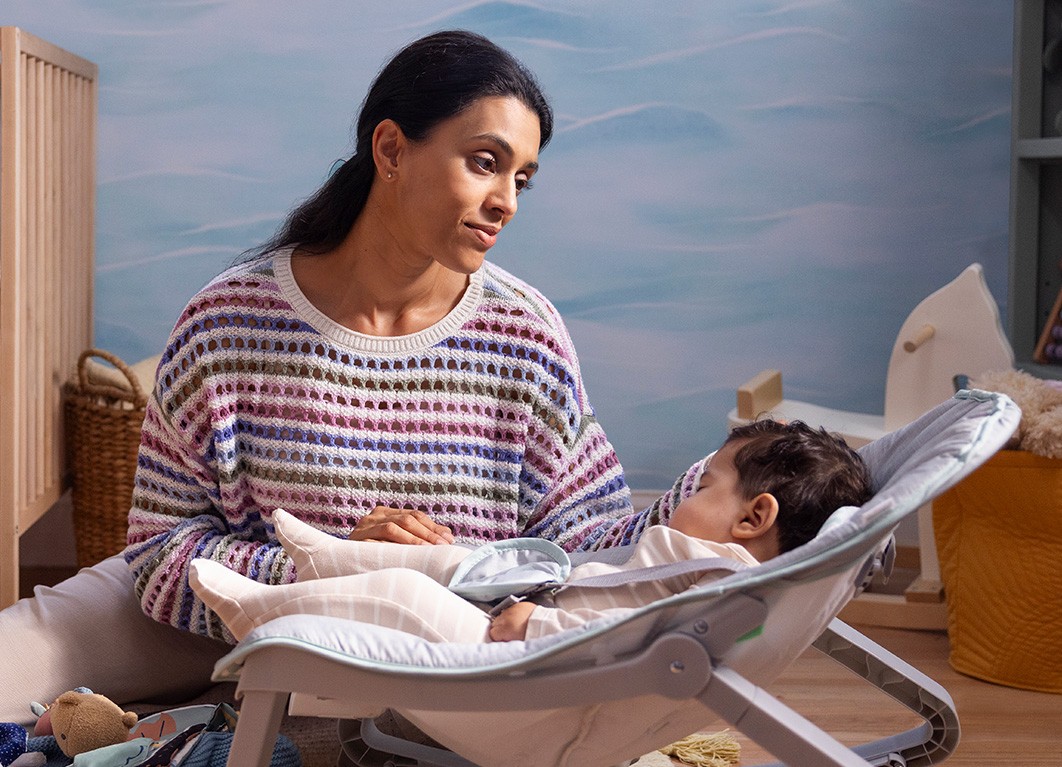 Woman in a nursery with her baby