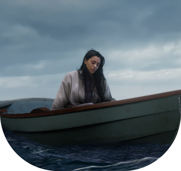 sad woman in boat